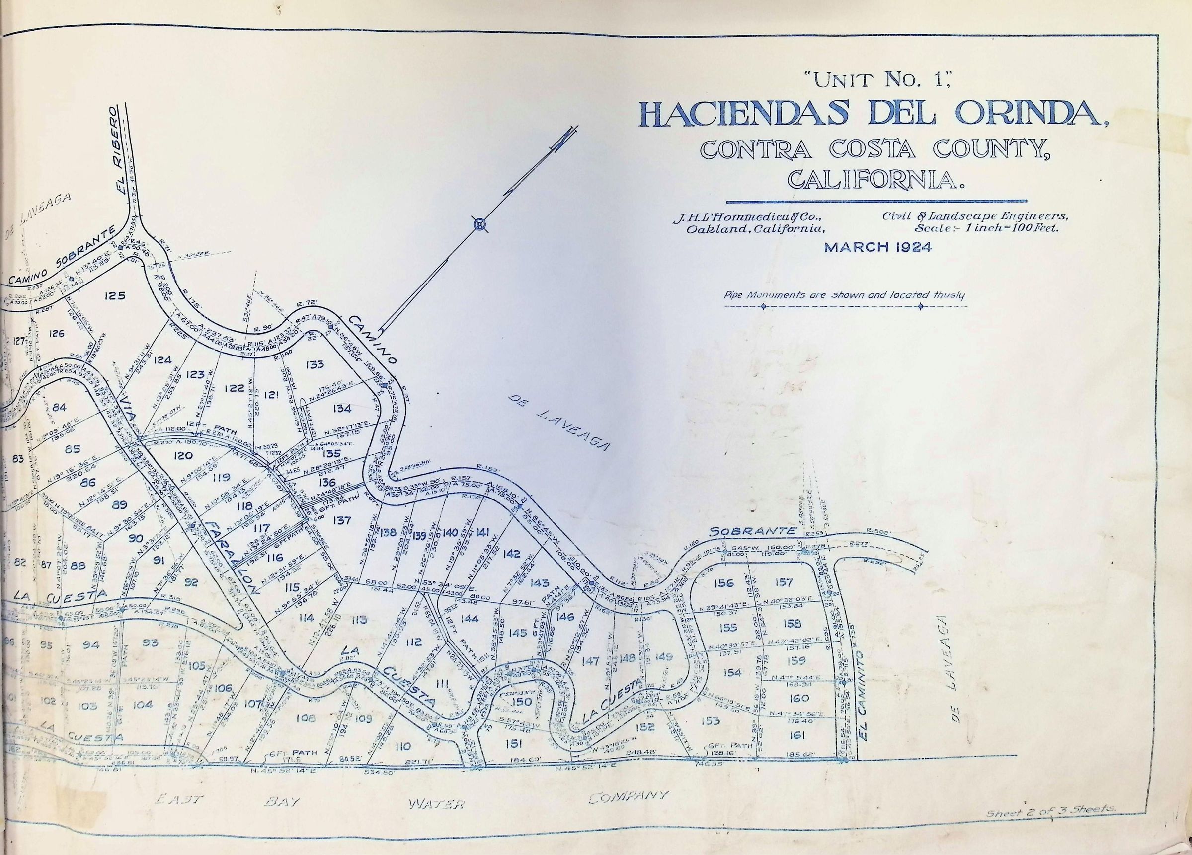 The image is a detailed map titled "Unit No. 1, Haciendas Del Orinda, Contra Costa County, California," prepared by J.H. Lhommedieu & Co., Civil and Landscape Engineers, in March 1924, with a scale of 1 inch to 100 feet. It depicts a planned residential layout featuring curved roads such as Camino Sobrante, El Mirador, La Cuesta, and Farallon, which intersect various parcels numbered systematically from 84 to 161. These parcels are delineated with precise measurements, showing dimensions in feet along the edges. To the north, the map highlights areas labeled "De Laveaga" and shows a point of reference by depicting a pipe monument for navigation. The southern boundary is marked by the East Bay Water Company, aligning with a curved waterway. The map is sheet 2 of 3, providing a thorough insight into early 20th-century land planning practices.