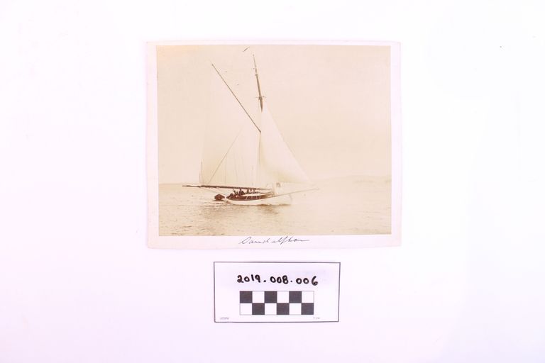 Sailboat Sandalphon with a Large Crew and a Dinghy Close Behind