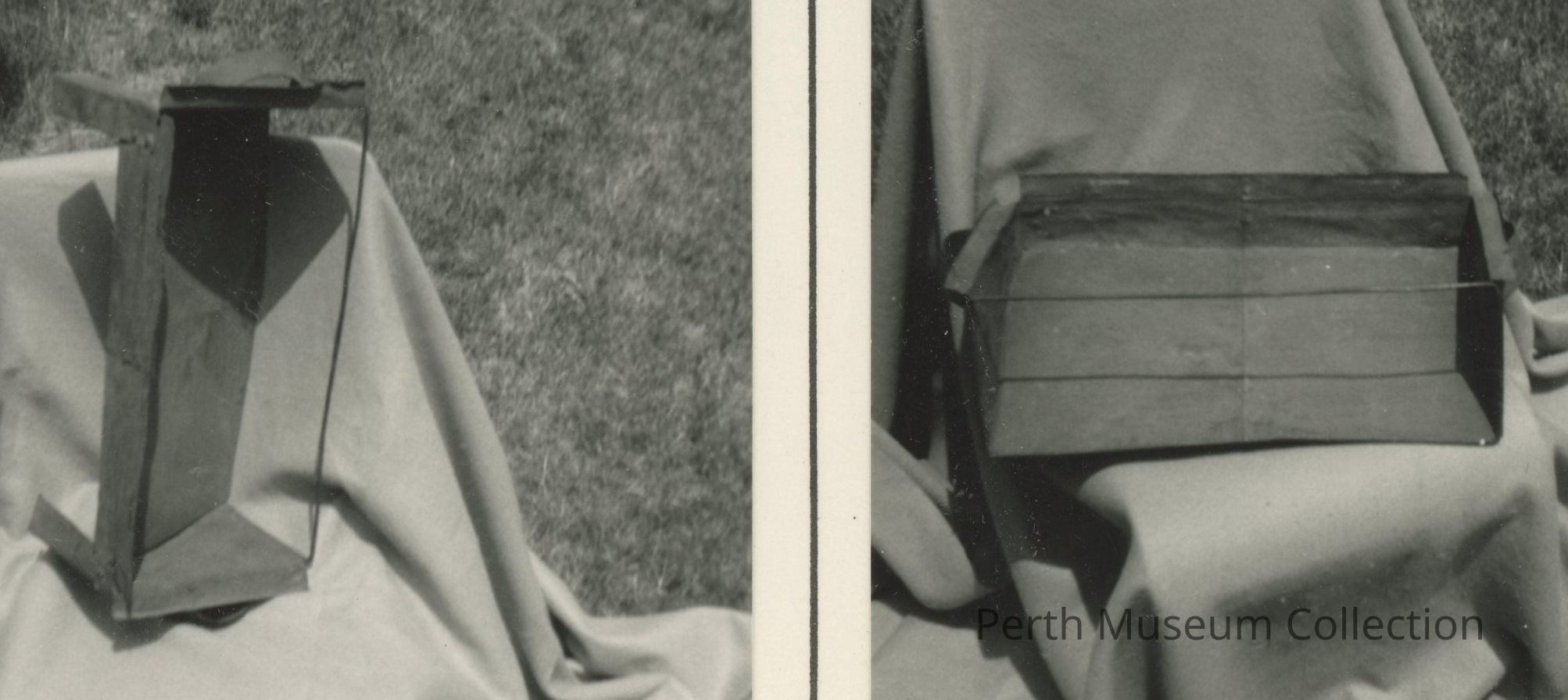 Oven, Reflector: The image shows two parts of a rectangular box-like structure placed on a cloth-covered surface outdoors; on the left, the box is viewed from the side, revealing a triangular opening, while on the right, the box is displayed horizontally, with its flat top visible, and both views are captured in black and white, highlighting the juxtaposition of shadows and the texture of the fabric in the background, lending a rustic and somewhat industrial feel to the overall composition.