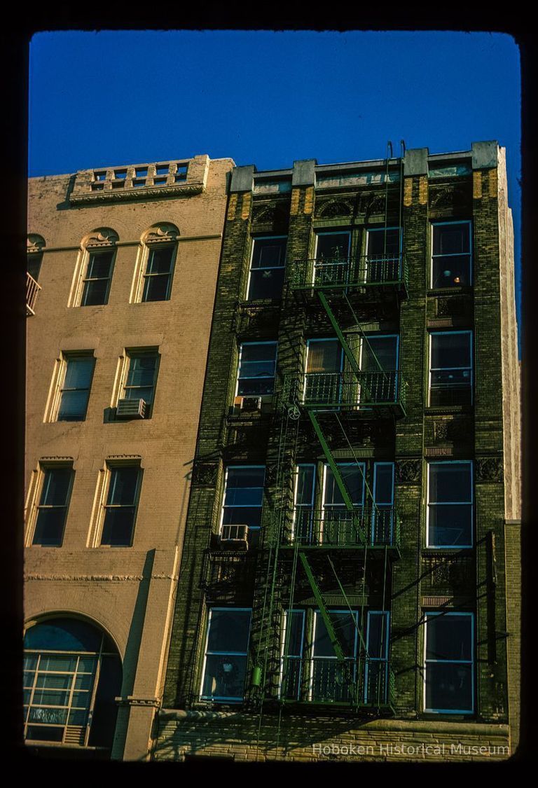 Color slide of detail view of row house façades, pilasters and fire escape on buildings at an unidentified location picture number 1