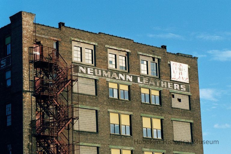 Color photo of painted wall signage for Neumann Leathers, 300 Observer Highway, Hoboken, Jan. 3 & 4, 2002. picture number 1