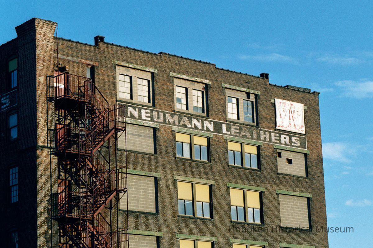 Color photo of painted wall signage for Neumann Leathers, 300 Observer Highway, Hoboken, Jan. 3 & 4, 2002. picture number 1