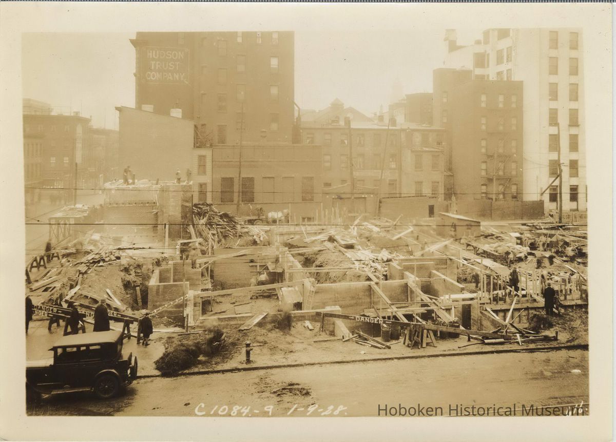 Sepia-tone photo of progress in foundation construction on the site for the Fabian Theatre, Newark & Washington Sts., Hoboken, Jan. 9, 1928. picture number 1