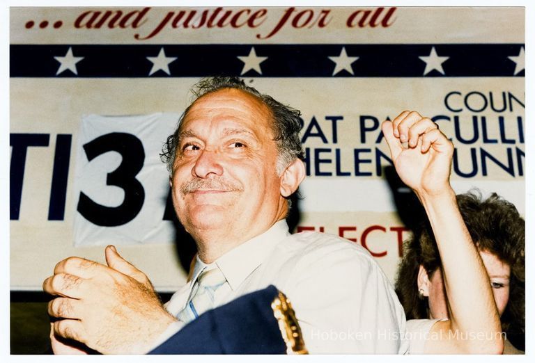 Color photo of mayoral candidate Tom Vezzetti with supporters in front of his campaign headquarters on election night, Hoboken, [June 11, 1985]. picture number 1