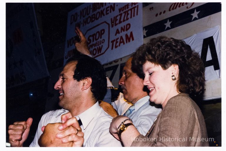 Color photo of mayoral candidate Tom Vezzetti with supporters in front of his campaign headquarters on election night, Hoboken, [June 11, 1985]. picture number 1