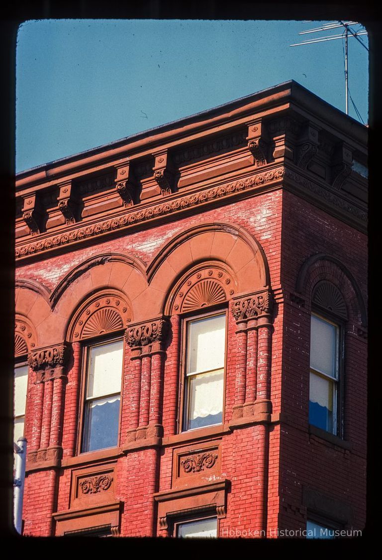 Color slide of detail view of cornice, brick pilasters, and arched windows at 938 Washington at the intersection of Washington & 10th picture number 1