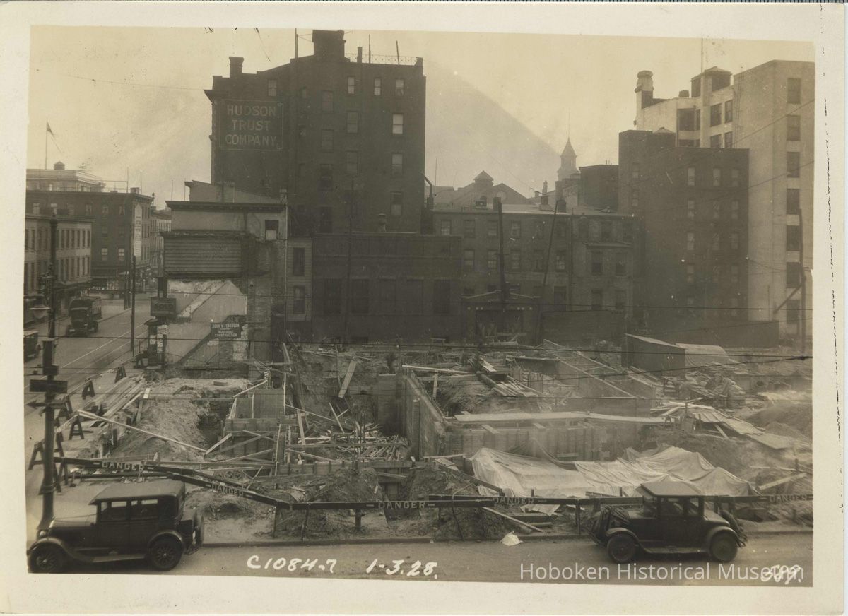 Sepia-tone photo of foundation preparation and concrete forms on the north end of the site for the Fabian Theatre, Hoboken, Jan 3, 1928. picture number 1