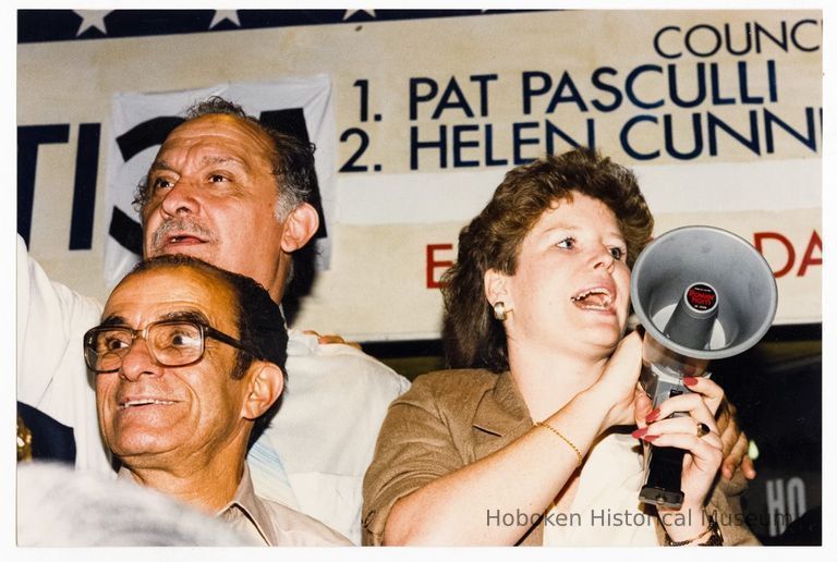 Color photo of mayoral candidate Tom Vezzetti with supporters in front of his campaign headquarters on election night, Hoboken, [June 11, 1985]. picture number 1