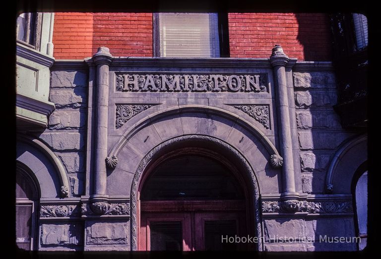 Color slide of detail view of portico frieze reading 