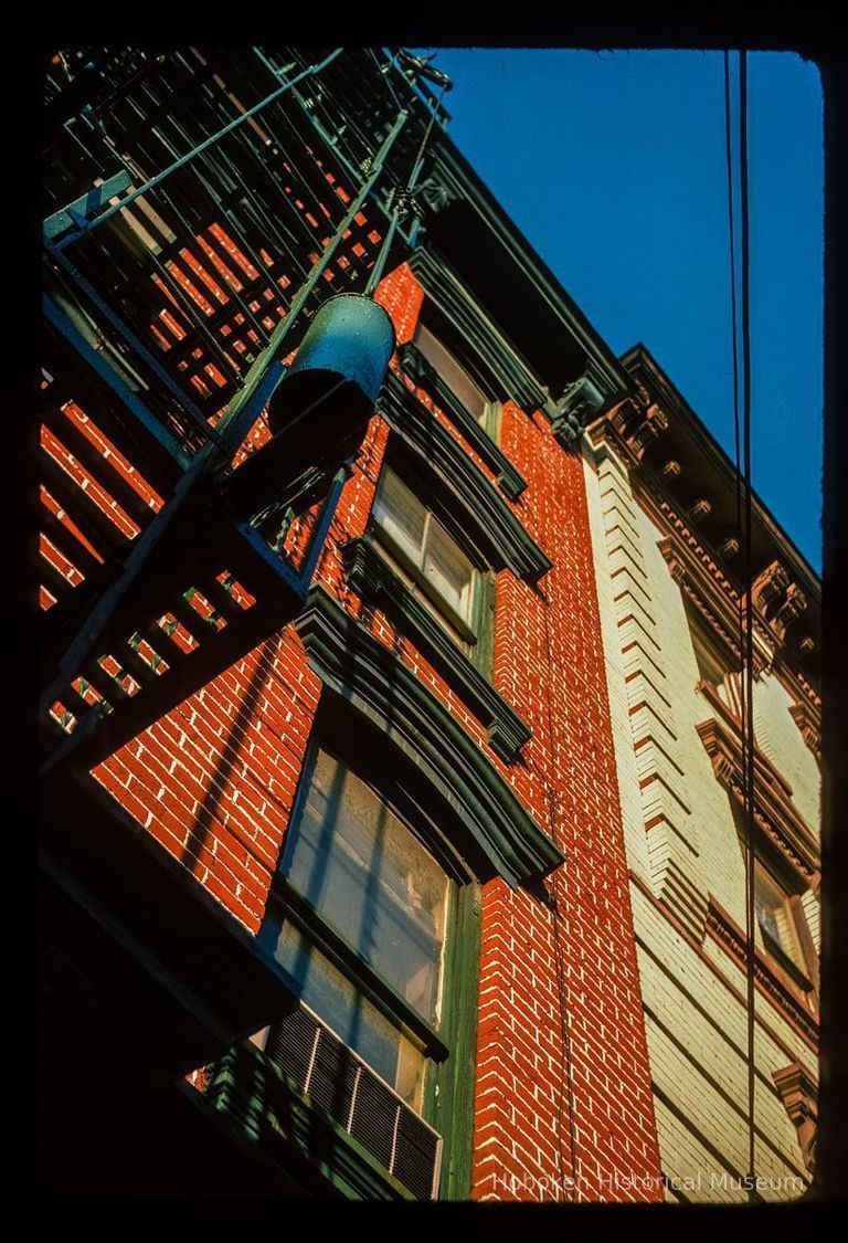 Color slide of detail view of cornices, brick pilaster, fire escape and window pediments at 204 3rd & 300 Garden picture number 1