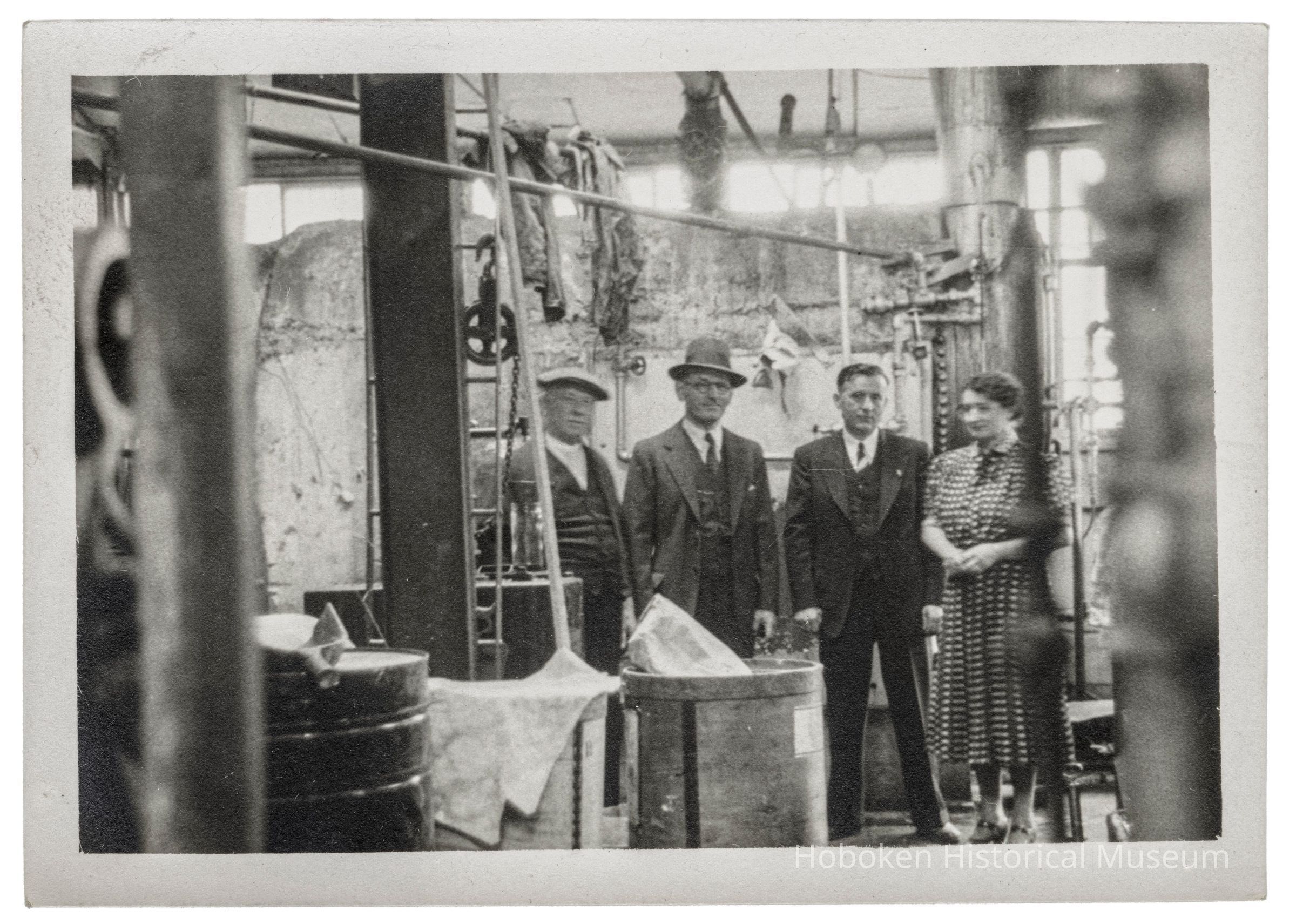 Photograph of the Interior of the Hoboken Individual Laundry with three men and a woman picture number 1