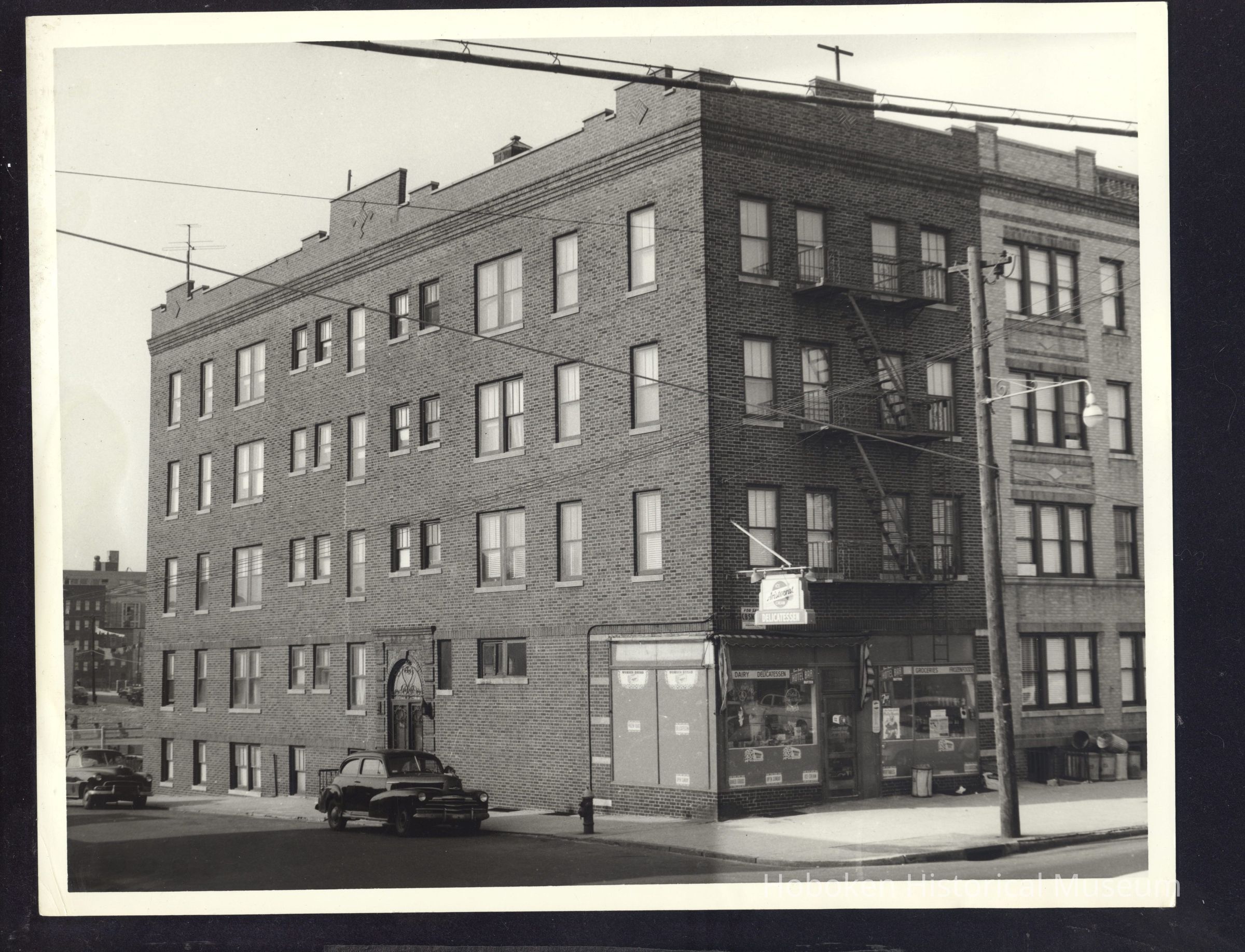 B&W photo of mixed-use apartment building at 100 53rd Street, West New York. picture number 1