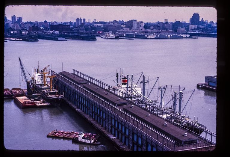 Color slide of aerial view from River and 3rd looking E at Pier B with the New York City skyline across the Hudson River picture number 1