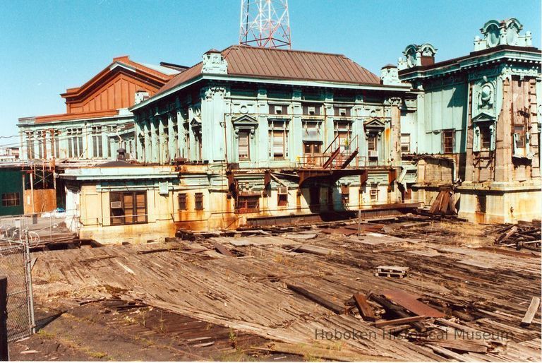 Digital image of color photo of the eastern facade of the Hoboken Terminal just south of the abandoned ferry slips, Hoboken, Sept., 1999. picture number 1