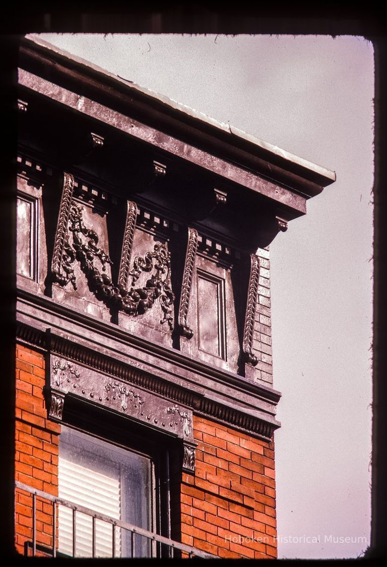 Color slide of detail view of cornice, brackets, frieze and window heads at 1029 Willow on the SE corner with 11th picture number 1