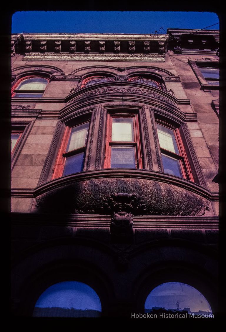 Color slide of close-up view of bay window, façade, semicircular arches and cornice at 1037 Bloomfield between 10th and 11th picture number 1