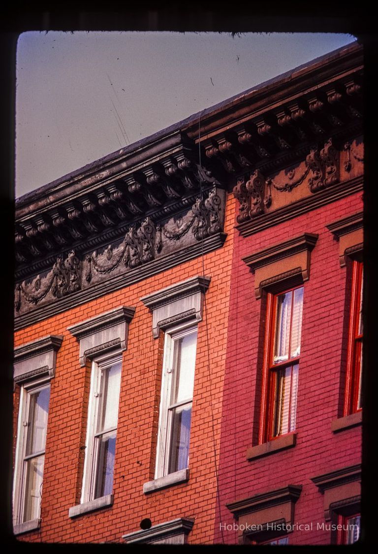 Color slide of detail view of cornices, brackets, friezes and window heads on two buildings on the E side of Willow between 12th and 13th picture number 1