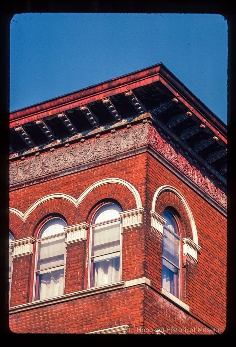 Color slide of close-up view of cornice, frieze, brick pilasters and semicircular arches at 1001 Bloomfield picture number 1