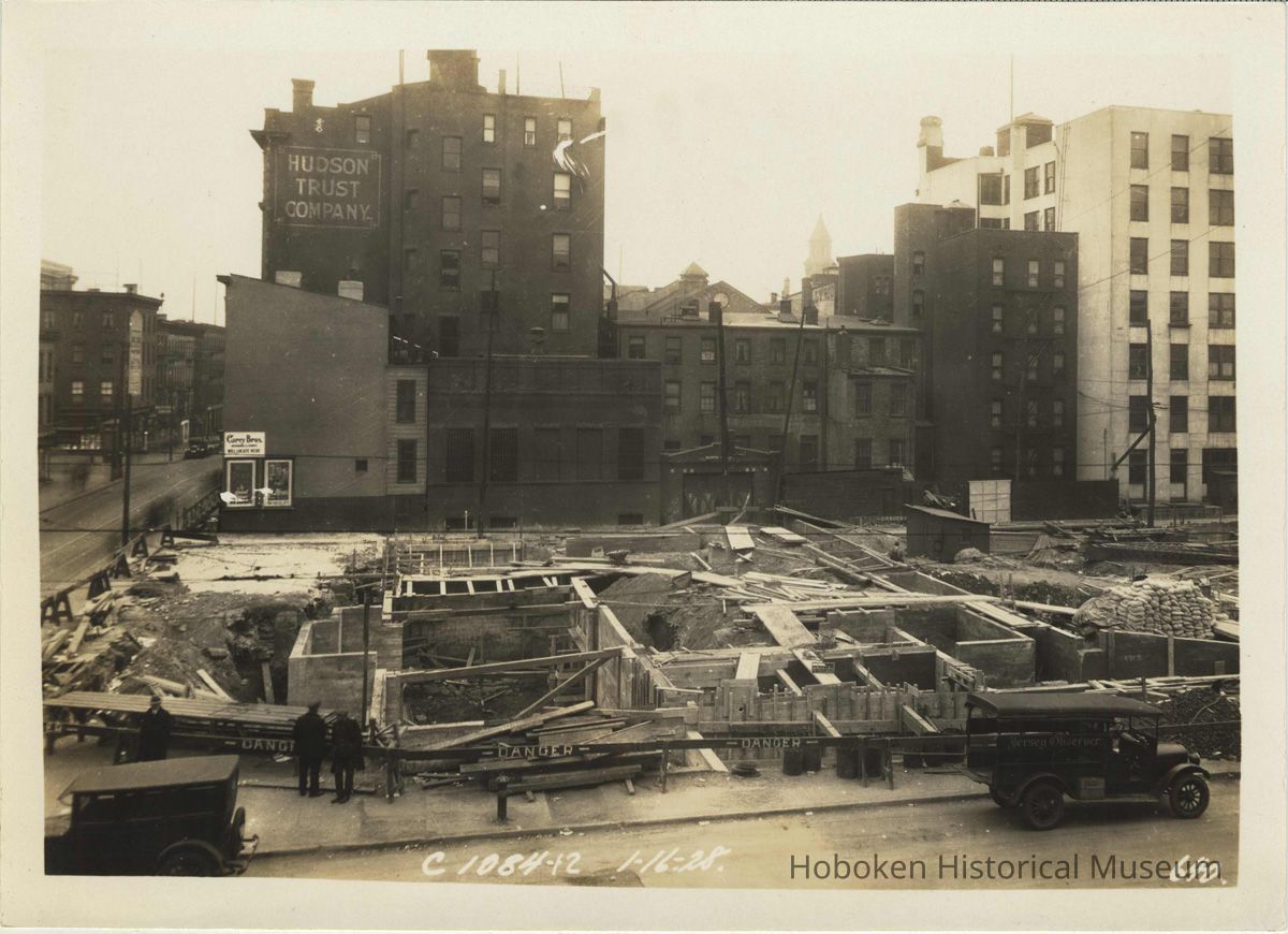 Sepia-tone photo of progress on foundation construction on the site for the Fabian Theatre, Newark & Washington Sts., Hoboken, Jan. 16, 1928. picture number 1