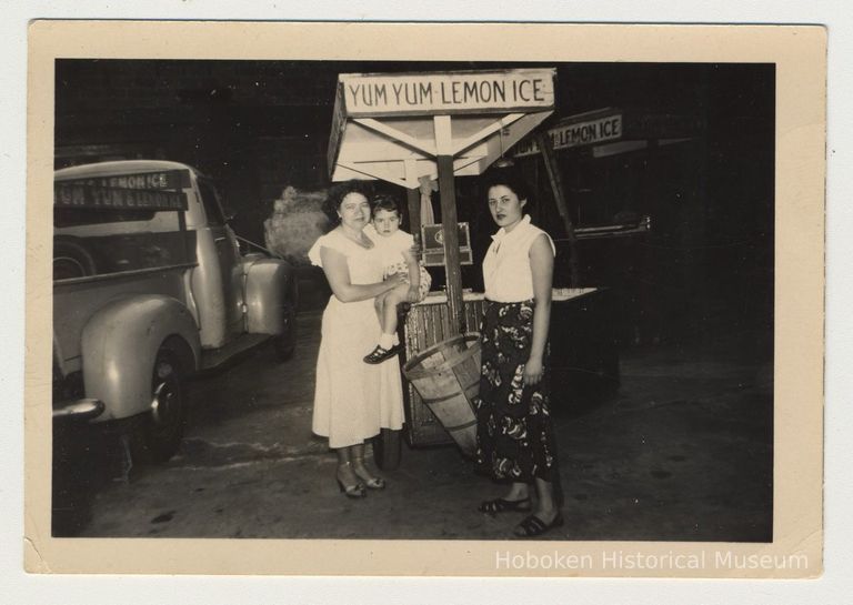 Digital image of b+w photo of Lucy Principe (left) holding Lucille Conti & Ann D'Atilla near a Yum Yum cart & truck, 416 Clinton St., Hoboken, n.d., ca. 1950s. picture number 1