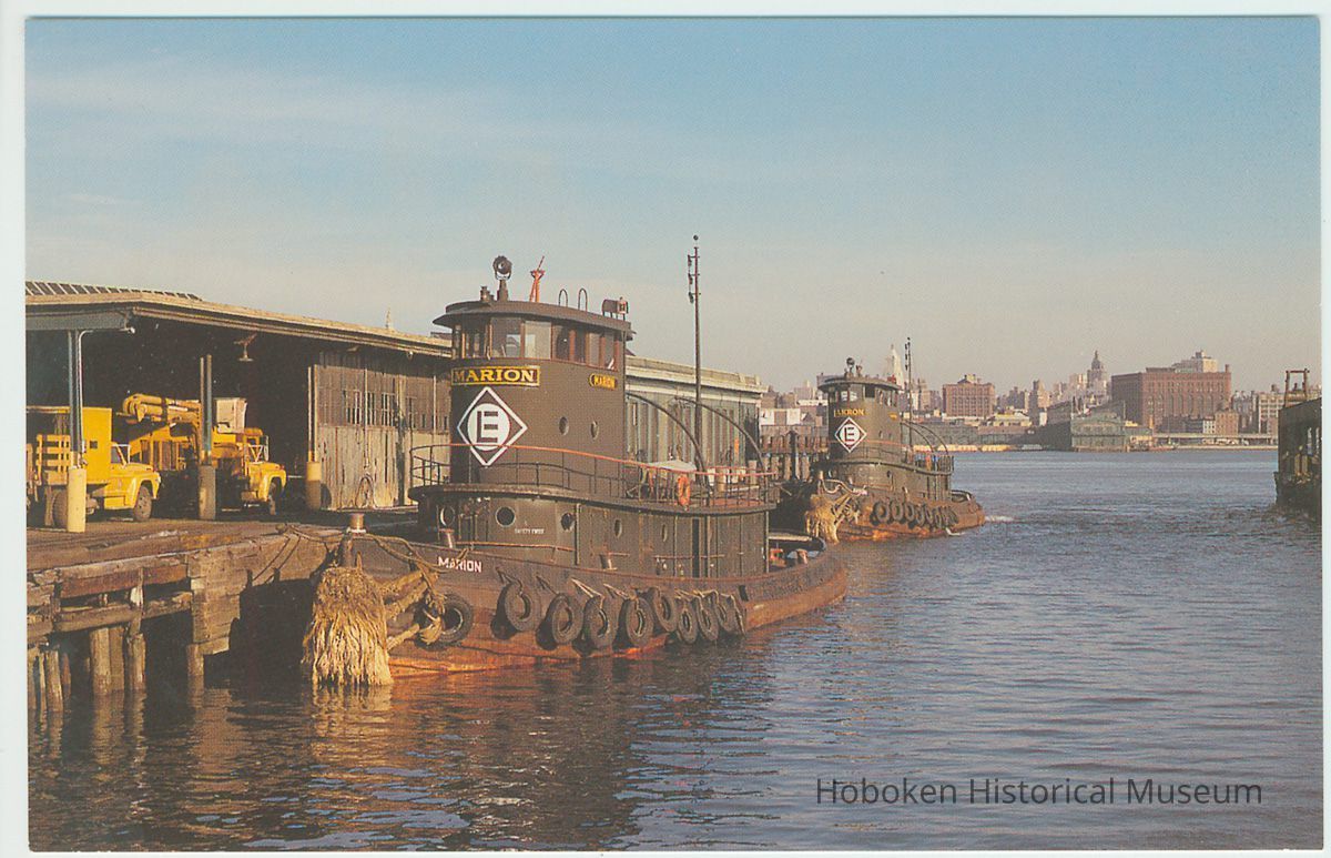Digital image of postcard of two Erie-Lackawanna tugboats docked at the Hoboken Terminal, Hoboken, Feb. 1974. picture number 1