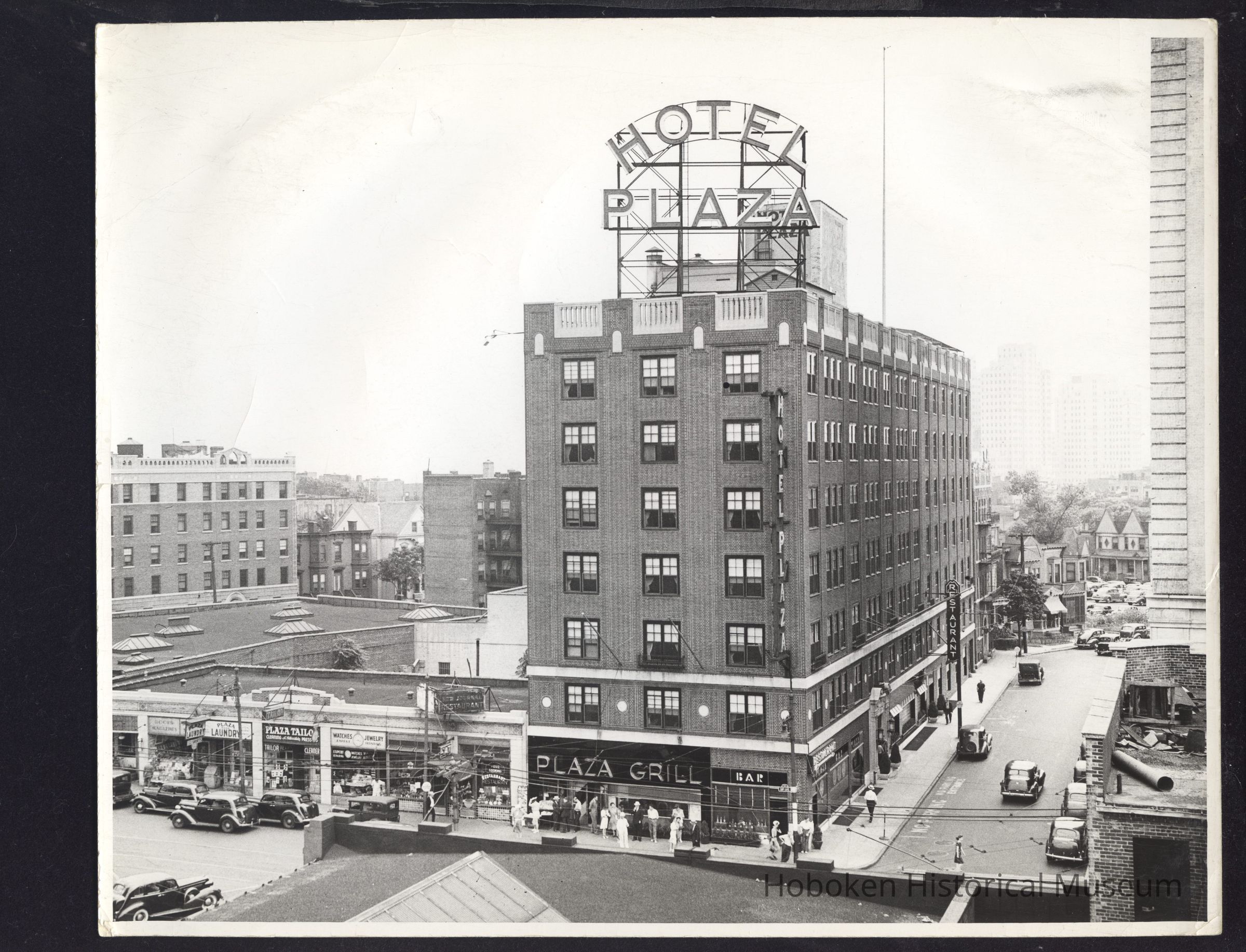 B&W photo of the mixed-use Hotel Plaza at 91 Sip Avenue, Jersey City. picture number 1