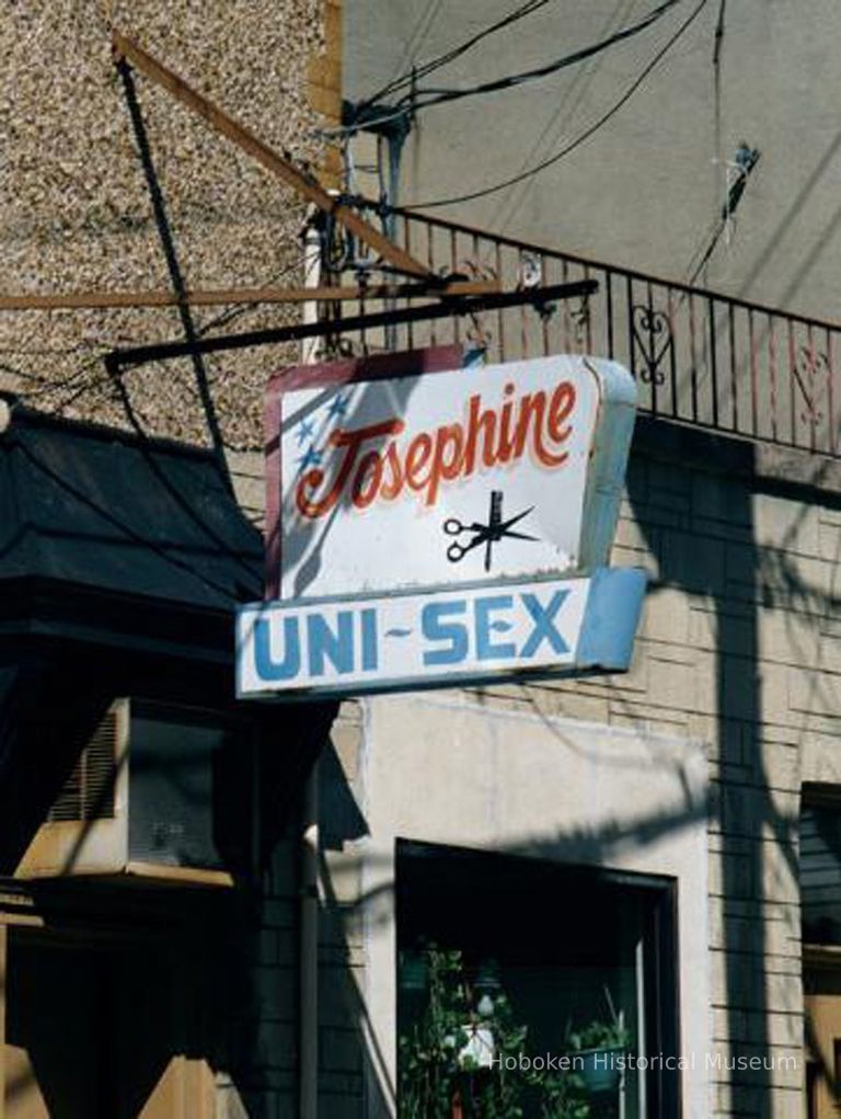 Color photo of hanging sign for Josephine Hair Sylist, 108 Fourth St., Hoboken, Sept. 1-5, 2001. picture number 1