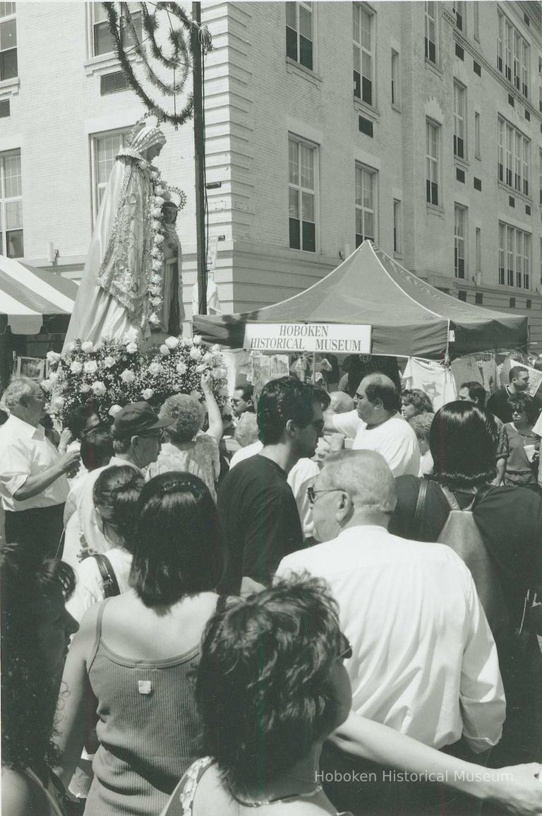 B+W photo of the St. Ann's Feast procession of the Madonna passing the Hoboken Historical Museum's booth, Hoboken, July, 2000. picture number 1