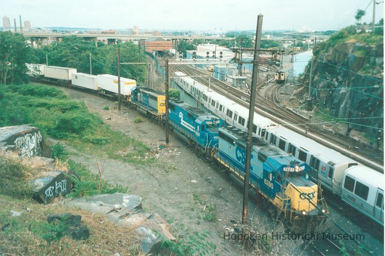 Digital image of color photo of a PATH train approaching Journal Square station from the east, June, 1999. picture number 1