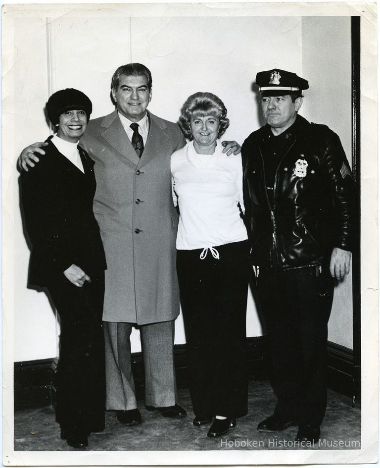 group photo (from left): Marion Roland; Peter Roland; woman; policeman