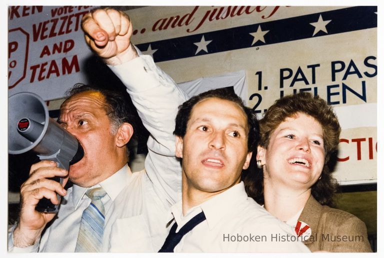 Color photo of mayoral candidate Tom Vezzetti with supporters in front of his campaign headquarters on election night, Hoboken, [June 11, 1985]. picture number 1