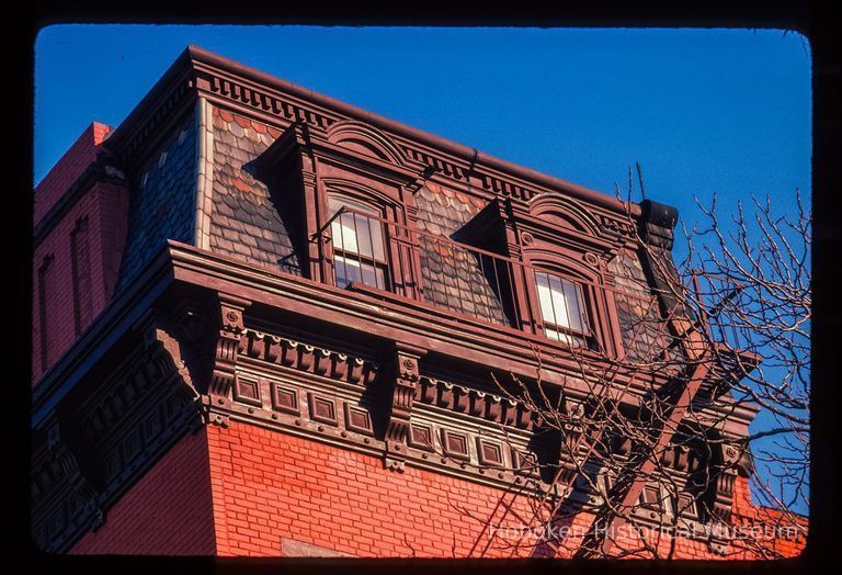 Color slide of close-up view of mansard roof, cornice and brackets at 636 Hudson on the SW corner of 7th picture number 1