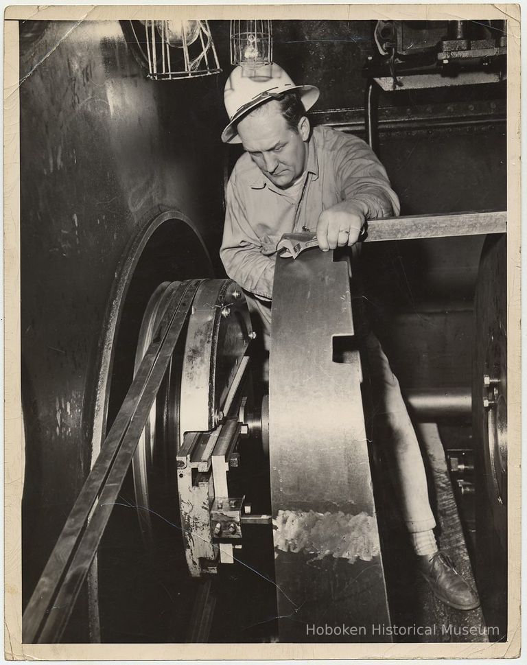 B+W photo of man working on a shaft at Bethlehem Steel Shipyard, Hoboken, n.d., ca. 1960s. picture number 1