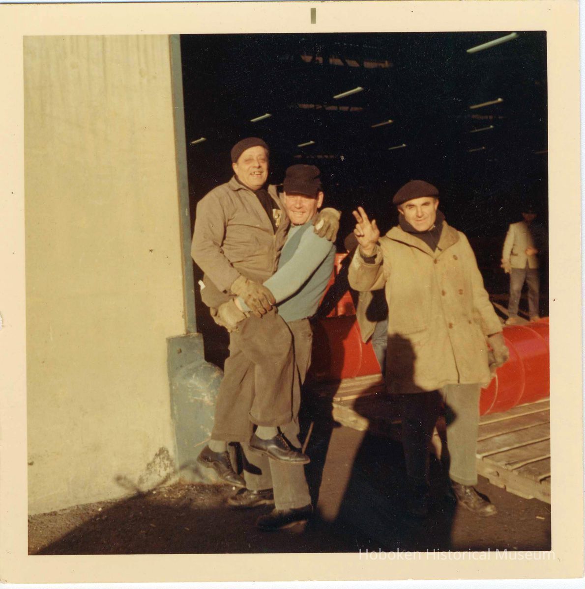 three longshoremen 'horsing around' on the Hoboken piers