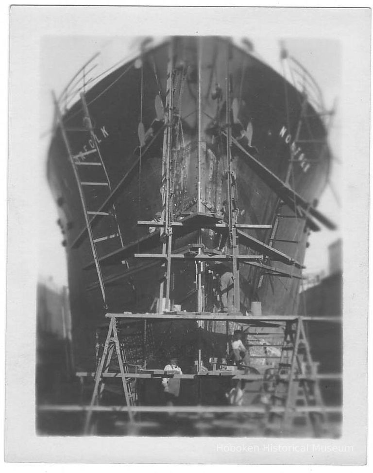 B+W photo of a heads-on view of bow repairs to the S.S. Norfolk in dry dock, Hoboken, no date, ca. 1940. picture number 1