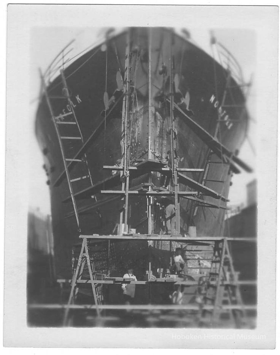 B+W photo of a heads-on view of bow repairs to the S.S. Norfolk in dry dock, Hoboken, no date, ca. 1940. picture number 1