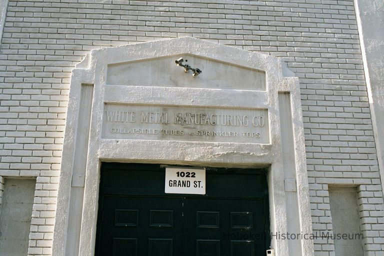 Color photo of building lettering for the former White Metal Manufacturing Company, 1022 Grand St., Hoboken, Jan. 3 & 4, 2002. picture number 1