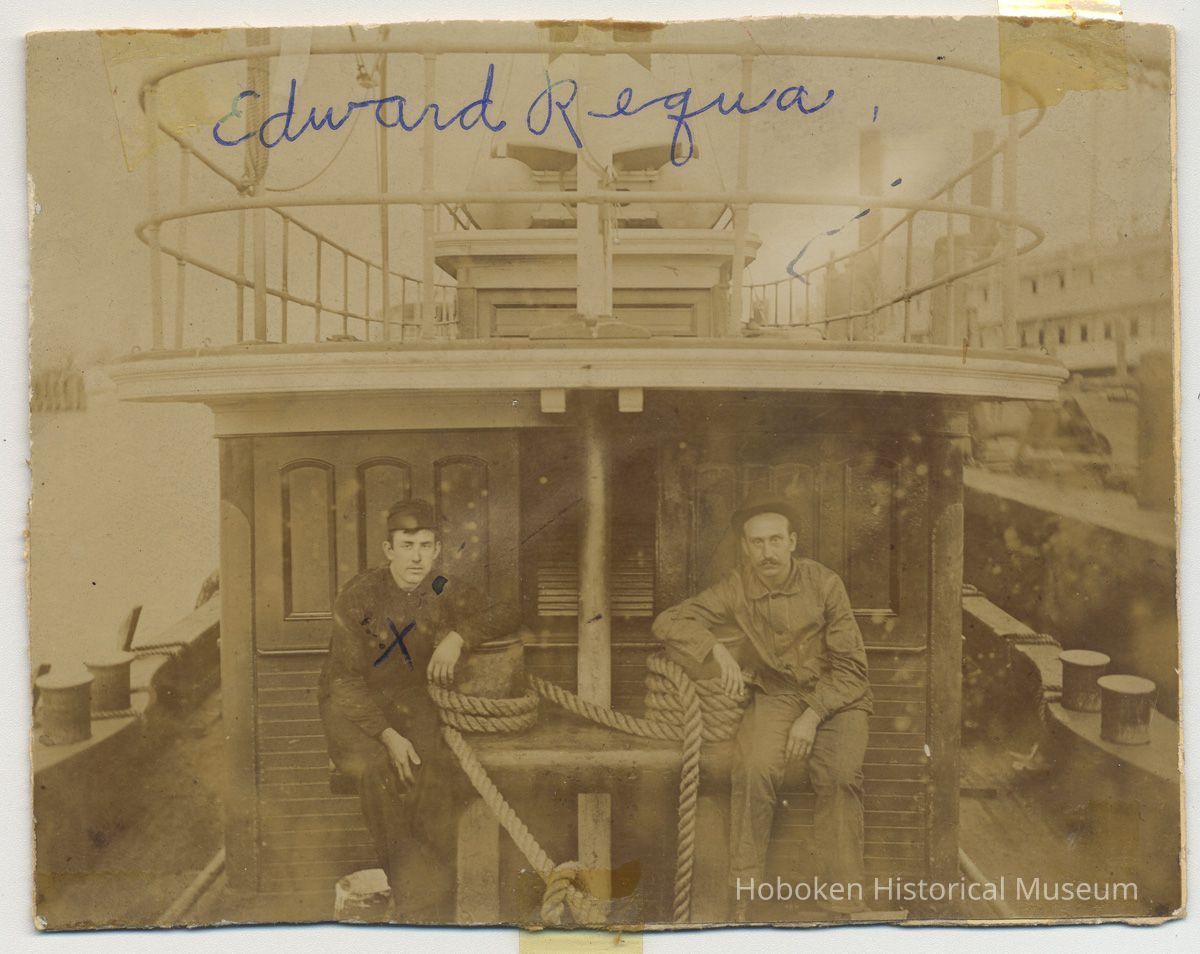 Sepia-tone photo of Edward Requa & a man aboard tugboat, Hoboken?, n.d., ca. 1900-1910. picture number 1
