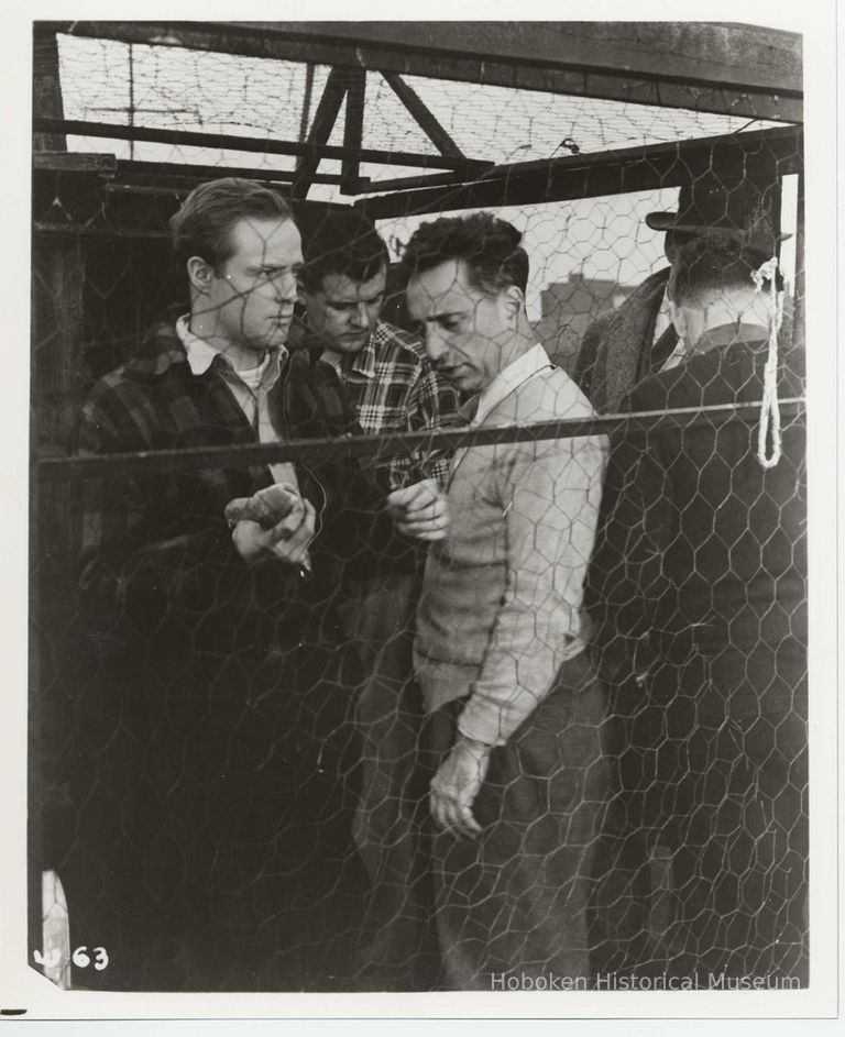 B+W publicity photo of Marlon Brando as Terry Malloy with director Elia Kazan on the set of film 