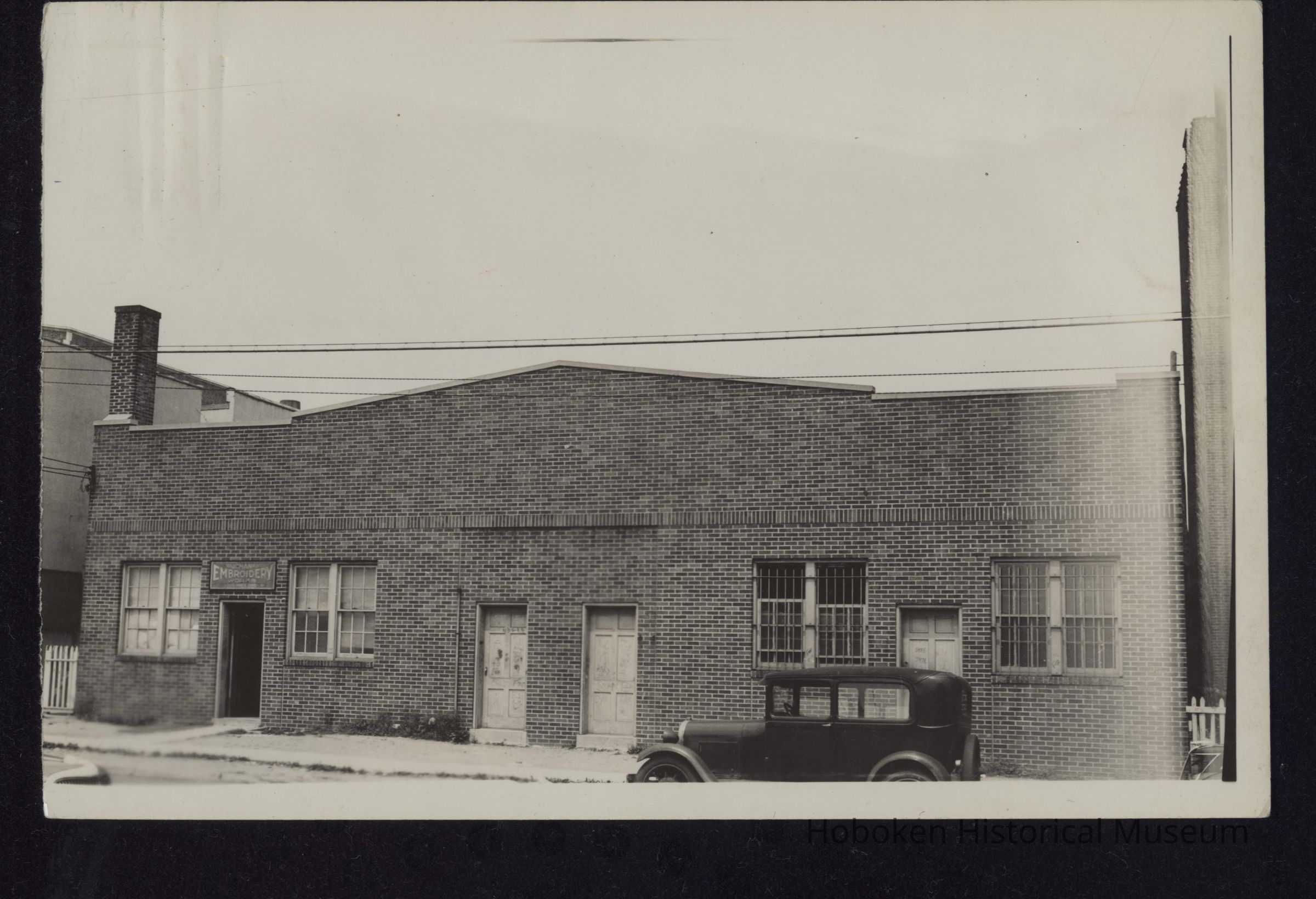 B&W photo of industrial building on the west side of Buchanan Place between 61st and 62nd Streets, West New York. picture number 1