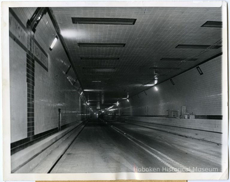 image: Lincoln Tunnel at state-line marker prior to opening, Nov. 1937