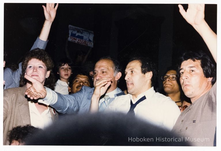 Color photo of mayoral candidate Tom Vezzetti in front of City Hall with supporters on election night, Hoboken, [June 11, 1985]. picture number 1