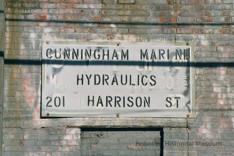 Color photo close-up of wall sign for Cunningham Marine Hydraulics, 201 Harrison Street at 2nd Street, Hoboken, Jan. 3 & 4, 2002. picture number 1