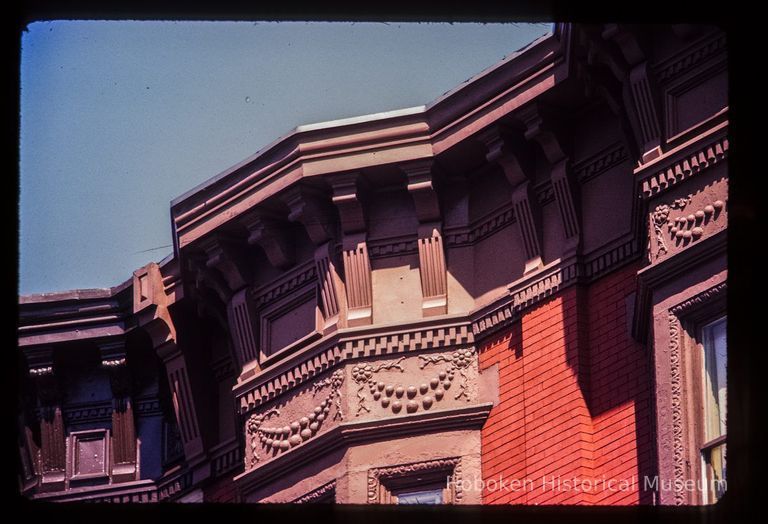 Color slide of close-up view of cornice, brackets, dentils and frieze at 809 and 811 Washington between 8th and 9th picture number 1