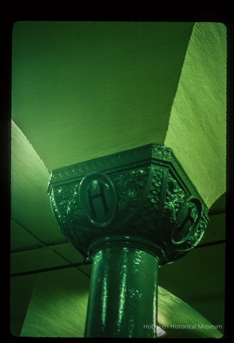 Color slide of interior detail view of a column with a capital reading 