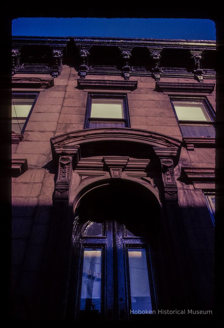 Color slide of eye-level view of façade, cornice, brackets, window heads and portico at 1017 Bloomfield between 10th and 11th picture number 1