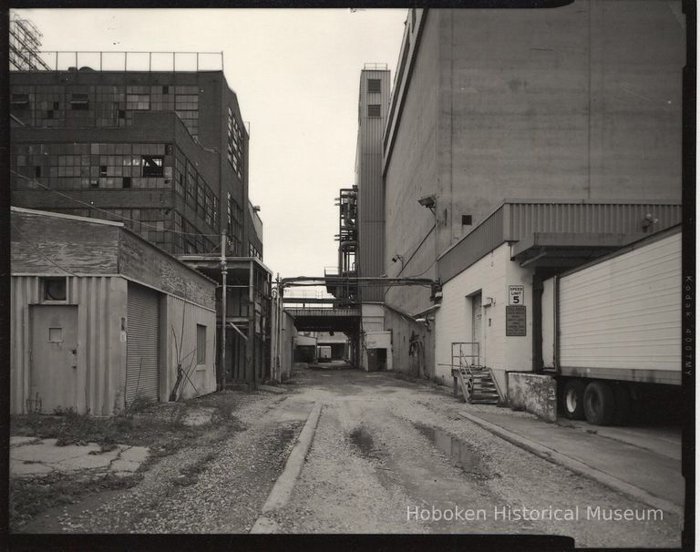 B+W photo of former Maxwell House Coffee plant exterior, looking north between Extraction Building & Storage Silos, Hoboken, 2003. picture number 1