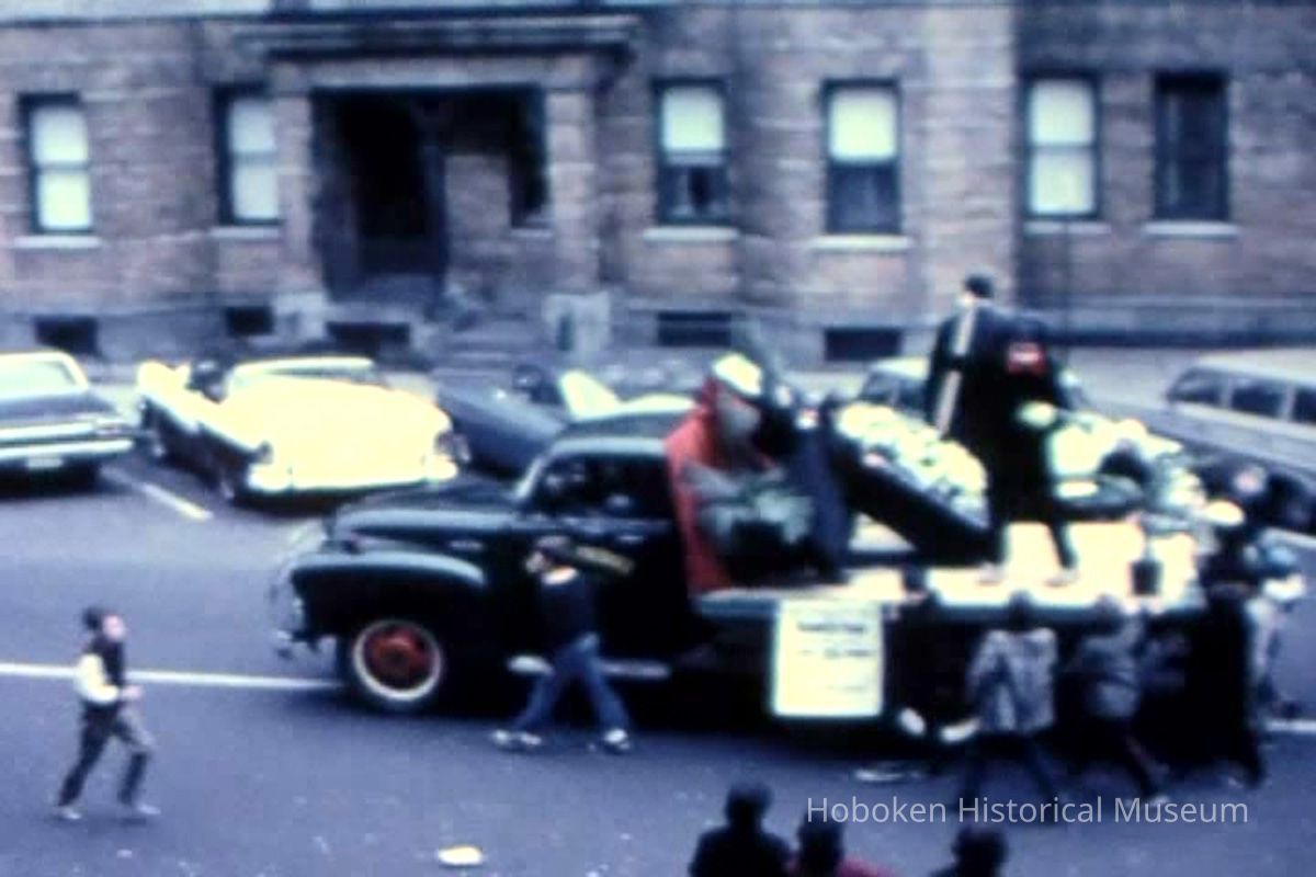 truck with coffin; Elysian Flats in background