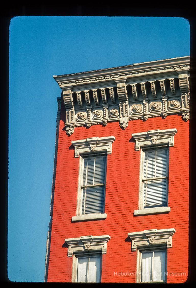 Color slide of detail view of cornice, brackets, frieze and window heads at an unidentified location. picture number 1