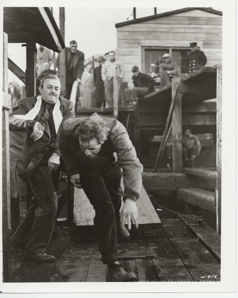 B+W publicity photo of Lee J. Cobb as Johnny Friendly and Marlon Brando as Terry Malloy in film 